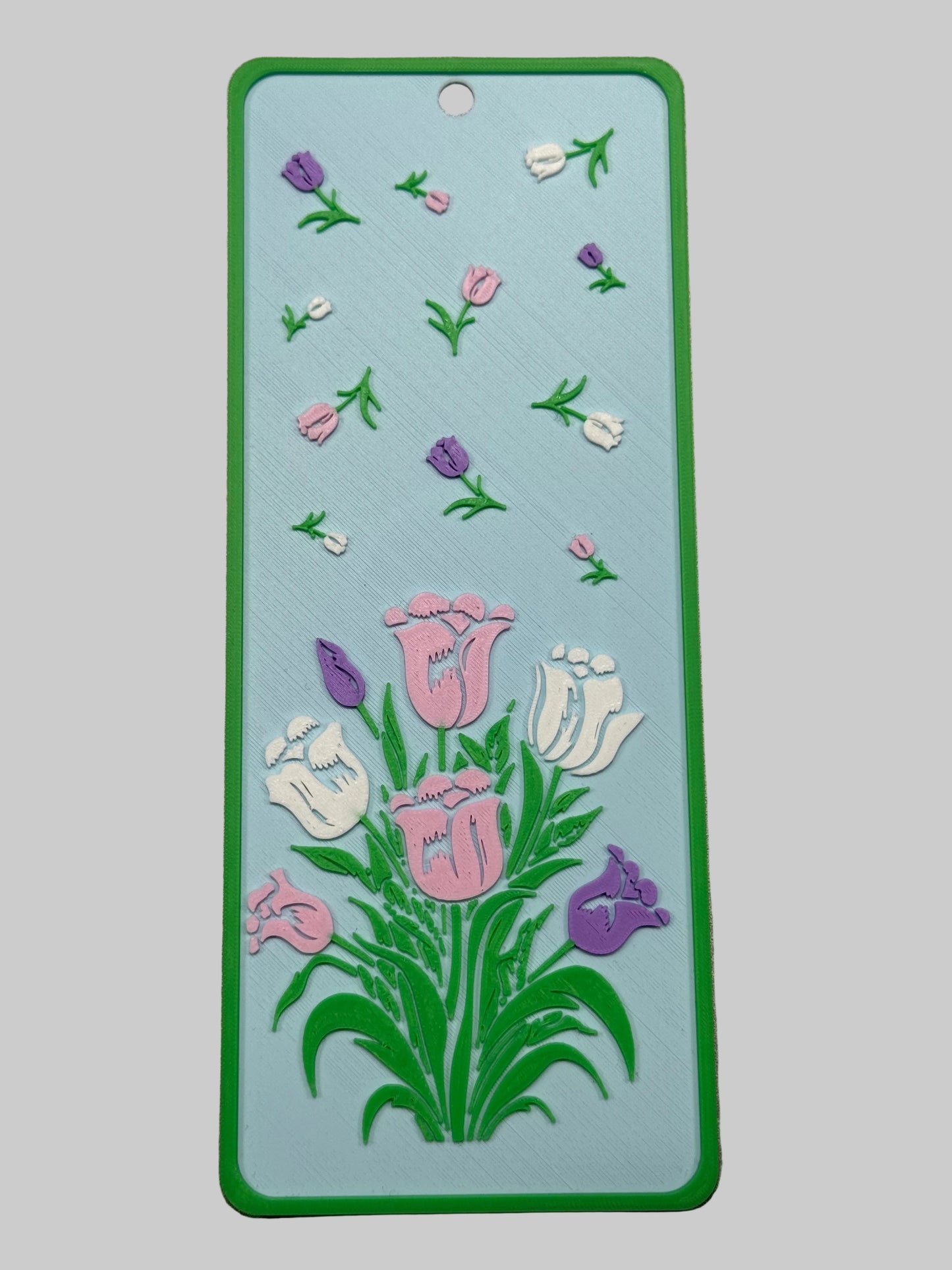 Floral design on a rectangular card with a green border.