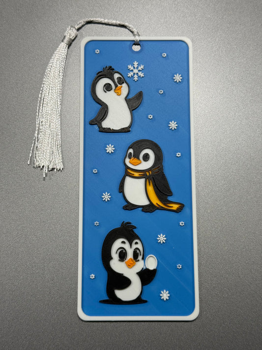 Bookmark with penguin design on a blue background
